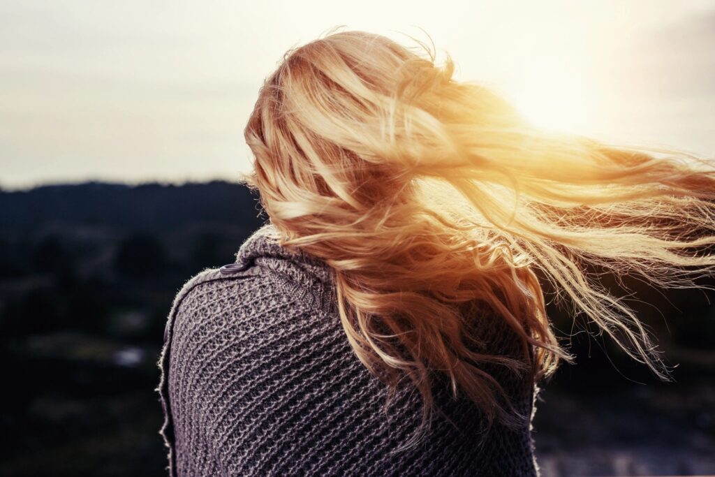 Woman turned away from the camera.  Represents someone with borderline personality disorder who doesn't trust others.
